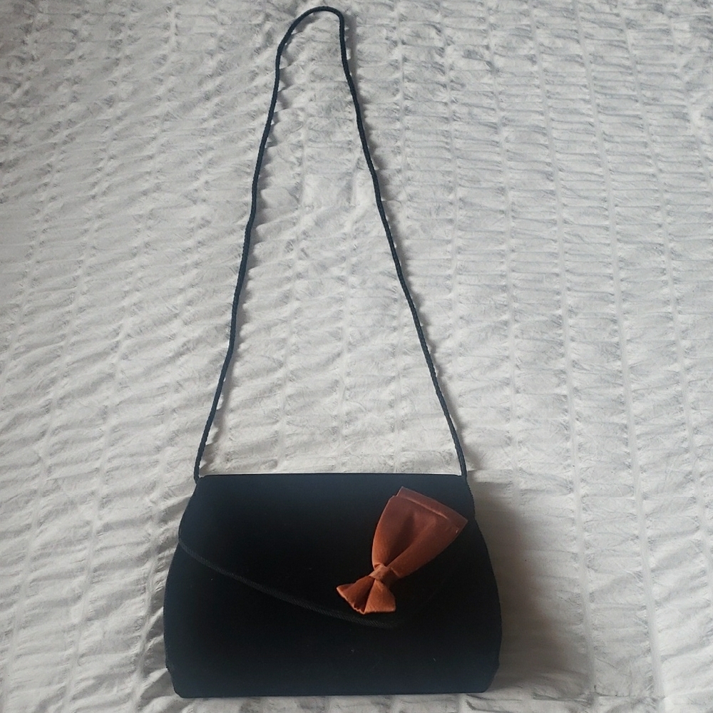 Black and Brown Crossbody Bag with Chain Strap and Flap Closure